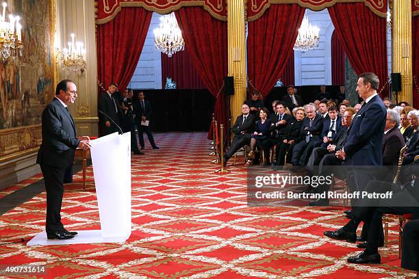 French President Francois Hollande gives to Director of sponsorship LVMH, Jean-Paul Claverie, Insignia of Officer of the Legion of Honor at Elysee...