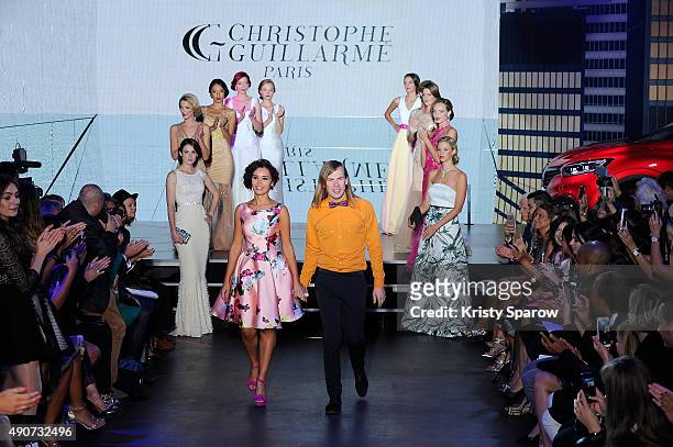 Christophe Guillarme and Aida Touihri acknowledge the audience during the finale of the Christophe Guillarme show as part of Paris Fashion Week...