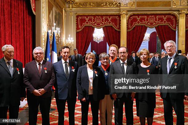 French President Francois Hollande gives to Director of sponsorship LVMH, Jean-Paul Claverie , Insignia of Officer of the Legion of Honor at Elysee...