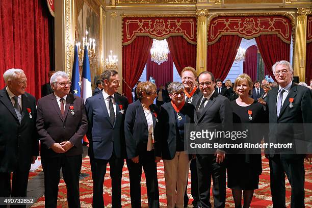 French President Francois Hollande gives to Director of sponsorship LVMH, Jean-Paul Claverie , Insignia of Officer of the Legion of Honor at Elysee...