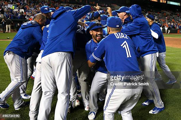 The Toronto Blue Jays celebrate after defeating the Baltimore Orioles and clinching the AL East Division during game one of a double header at Oriole...