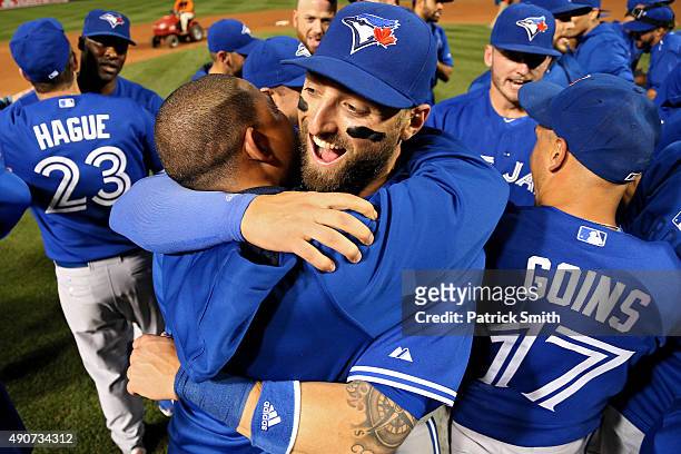 Kevin Pillar and the Toronto Blue Jays celebrate after defeating the Baltimore Orioles and clinching the AL East Division during game one of a double...