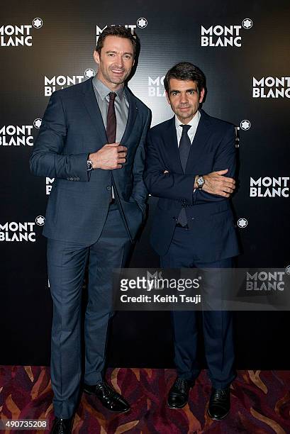 Hugh Jackman and Montblanc CEO Jerome Lambert attend a photo call at the Montblanc Gala Dinner during Watches and Wonders 2015 Exhibition in Grand...