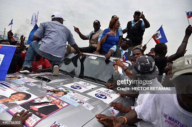 Maryce Narcisse, presidential candidate from the Lavalas Political party arrives at a party presidential campaign in Port-au-Prince, on September 30,...