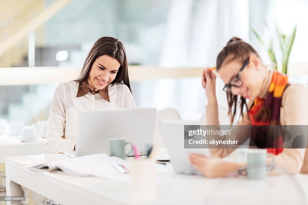 Female Using Technology Women Using Wireless Technology In Office High-Res Stock Photo - Getty ...