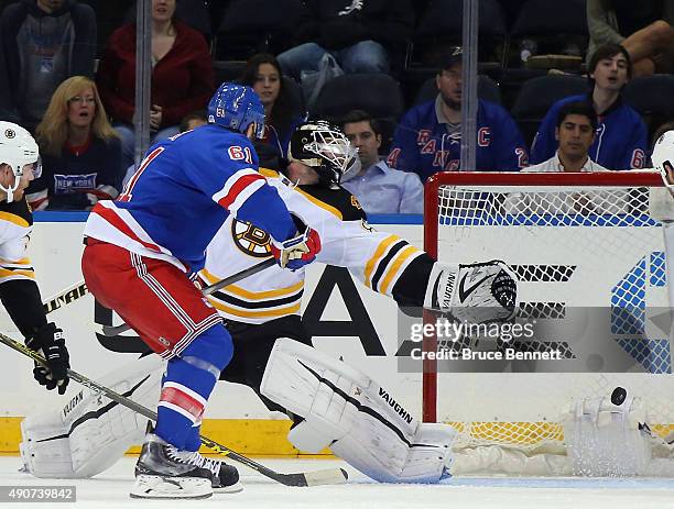 Rick Nash of the New York Rangers scores a third period goal against Jonas Gustavsson of the Boston Bruins at Madison Square Garden on September 30,...