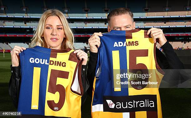 Singers Bryan Adams and Ellie Goulding pose with Aussie Rules Football guernseys during a 2015 AFL Grand Final Entertainment Media Opportunity at the...