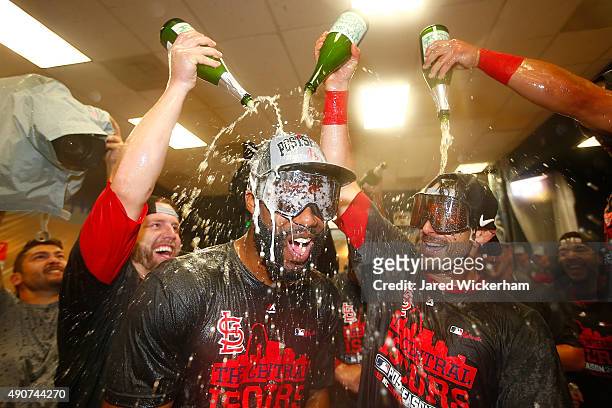 Jason Heyward of the St Louis Cardinals celebrates with teammates in the clubhouse following their division clinching 11-1 win against the Pittsburgh...
