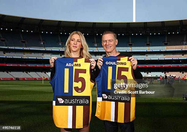 Singers Bryan Adams and Ellie Goulding pose with Aussie Rules Football guernseys during a 2015 AFL Grand Final Entertainment Media Opportunity at the...