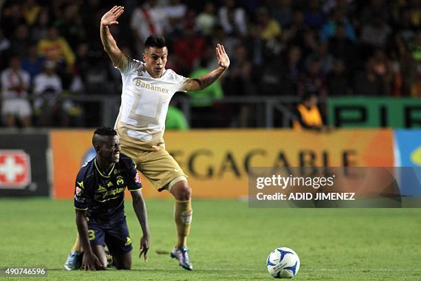 Jefferson Cuero of Morelia vies for the ball with Marcelo Alatorre of Pumas during their Mexican Apertura 2015 tournament football match at the...