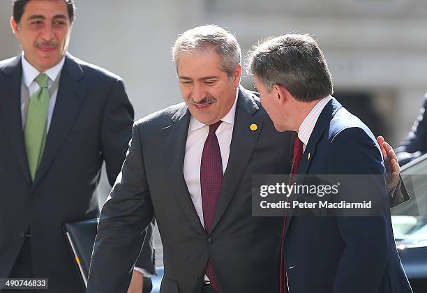 Jordanian Foreign Minister Nasser Judeh puts his arm round British Minister of State Hugh Roberts as he arrives at the Foreign and Commonwealth...