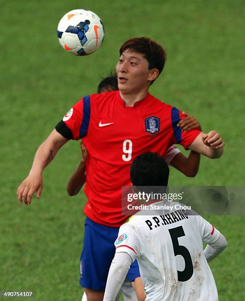 Park Eun Sun of Korea Republic is challenged by Phu Pwint Khang of Myanmar during the AFC Women's Asian Cup Group B match between Korea Republic and...