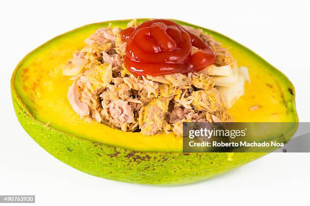 Avocado cut into half filled with tune, healthy eating for a diabetic person. Jamaican or Caribbean avocado.