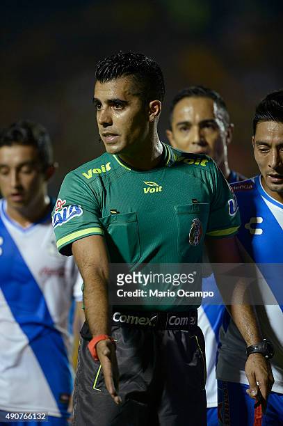 Referee Adonai Escobedo gestures during the 11th round match between Tigres UANL and Puebla as part of the Apertura 2015 Liga MX at Universitario...