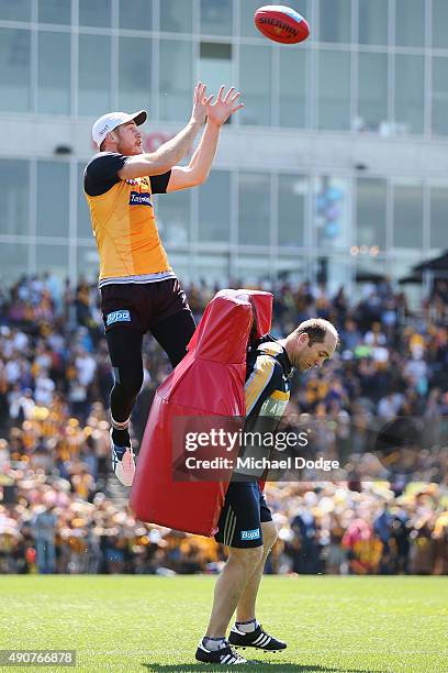 Jarryd Roughead of the Hawks marks the ball over assistant coach David Neitz during a Hawthorn Hawks AFL training session at Waverley Park on October...