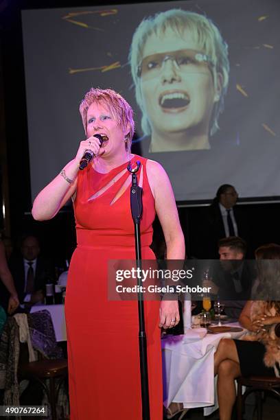 Corinna May sings during Ralph Siegel's 70th birthday party at Schuhbeck's Teatro on September 30, 2015 in Munich, Germany.