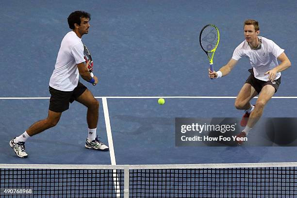 Rameez Junaid of Australia and Jonathan Marray of Germany competes against Raven Klaasen of RSA and Rajeev Ram of USA during the 2015 ATP Malaysian...