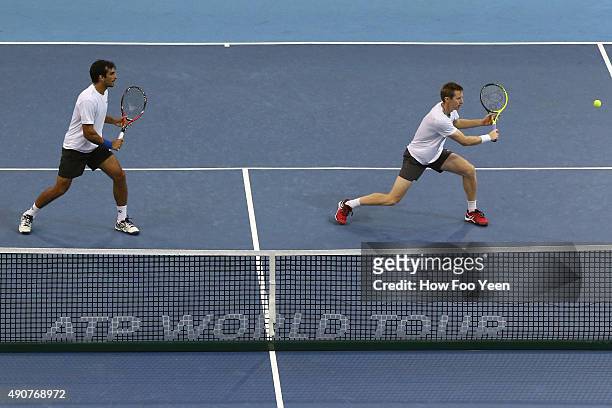 Rameez Junaid of Australia and Jonathan Marray of Germany competes against Raven Klaasen of RSA and Rajeev Ram of USA during the 2015 ATP Malaysian...