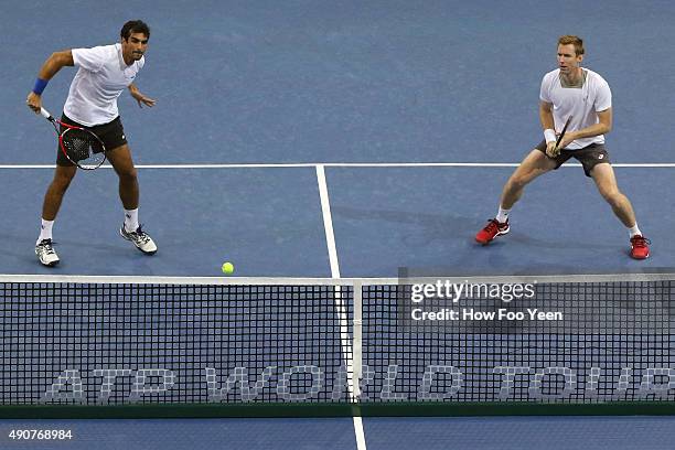 Rameez Junaid of Australia and Jonathan Marray of Germany competes against Raven Klaasen of RSA and Rajeev Ram of USA during the 2015 ATP Malaysian...