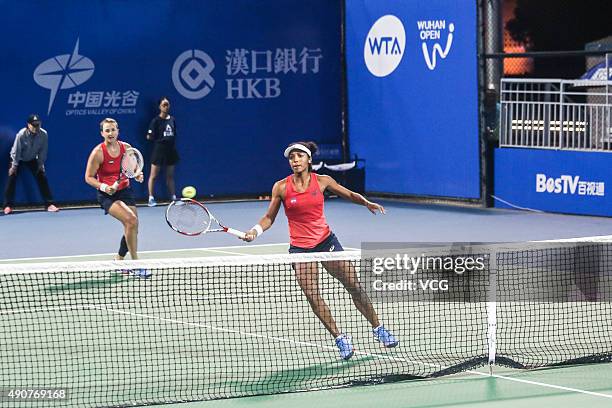 Raquel Kops-Jones and Abigail Spears of the United States compete against Xinyun Han of China and Nicole Melichar of the United States in Women's...