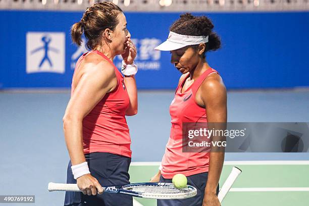 Raquel Kops-Jones and Abigail Spears of the United States talk in Women's Doubles match against Xinyun Han of China and Nicole Melichar of the United...