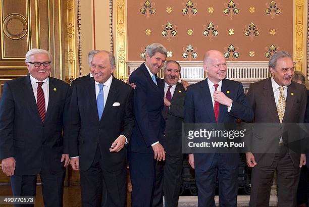 Secretary of State John Kerry jokes with Jordanian Foreign Minister Nasser Judeh as German Foreign Minister Frank-Walter Steinmeier , French Foreign...