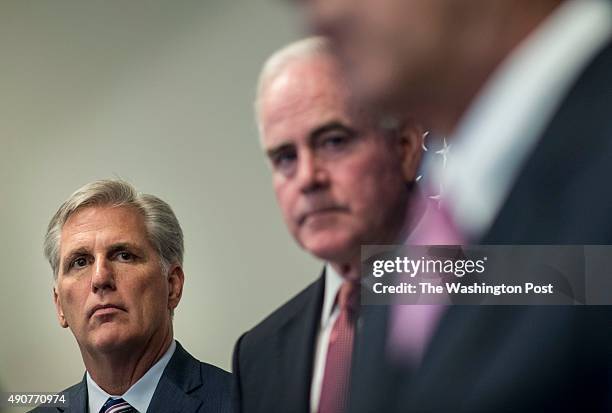 House Majority Leader Kevin McCarthy, left, and Congressman Pat Meehan , right, listen to Speaker of the House John Boehner answer questions from...