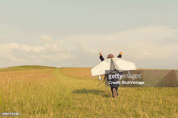 young business boy wearing jetpack en inglaterra - creatividad fotografías e imágenes de stock