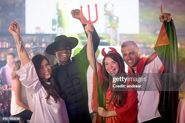 happy friends in a halloween party - halloween party imagens e fotografias de stock