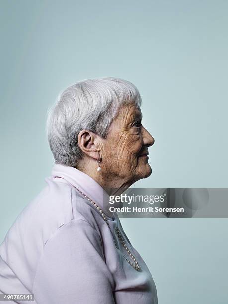 mature woman - portrait profile stock-fotos und bilder