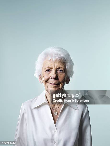 mature woman - senior studio portrait stock pictures, royalty-free photos & images