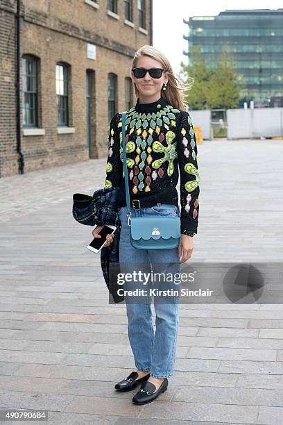 Teen Vogue Senior Fashion Market and Accessories Editor Jessica Minkoff wears a Love Moschino jacket, Peter Pilotto top, vintage jeans, Gucci shoes,...
