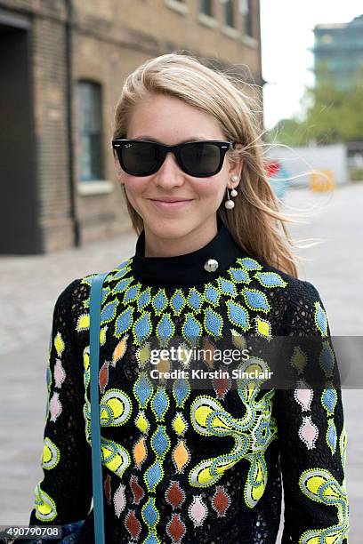 Teen Vogue Senior Fashion Market and Accessories Editor Jessica Minkoff wears a Love Moschino jacket, Peter Pilotto top and Ray Ban sunglasses on day...