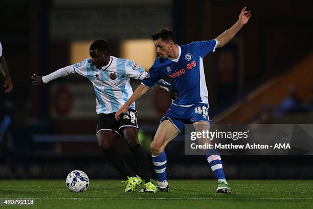 Larnell Cole of Shrewsbury Town and Ian Henderson of Rochdale during the Sky Bet League One match between Rochdale and Shrewsbury Town at Spotland...