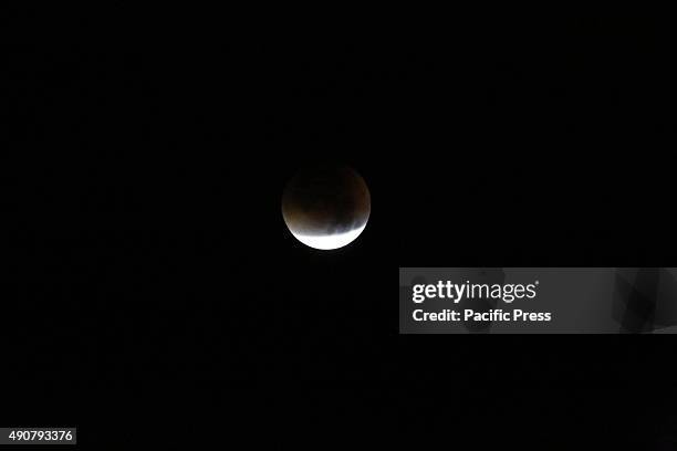 Super moon appeared copper red as its closest approach to Earth coincides with a total lunar eclipse on Monday morning at 4am. This astronomical...