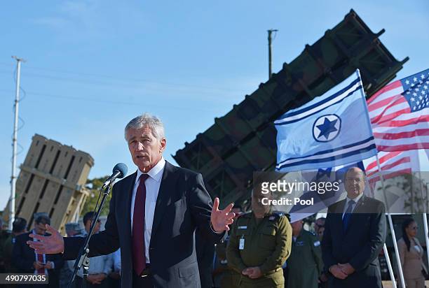 Defense Secretary Chuck Hagel stands in front of a Patriot missile battery while speaking to U.S. And Israeli troops after viewing Juniper Cobra 14...