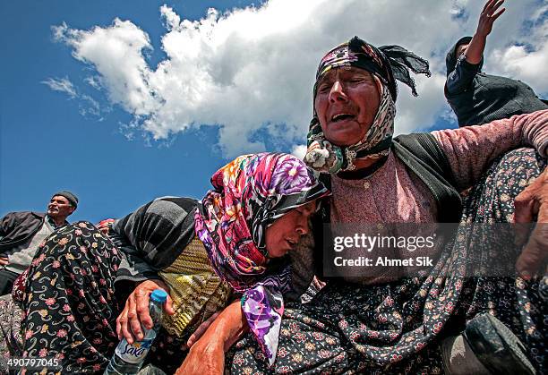 Relatives mourn during the funeral of the miners after a mining disaster on May 15, 2014 in Soma, a district in Turkey's western province of Manisa....