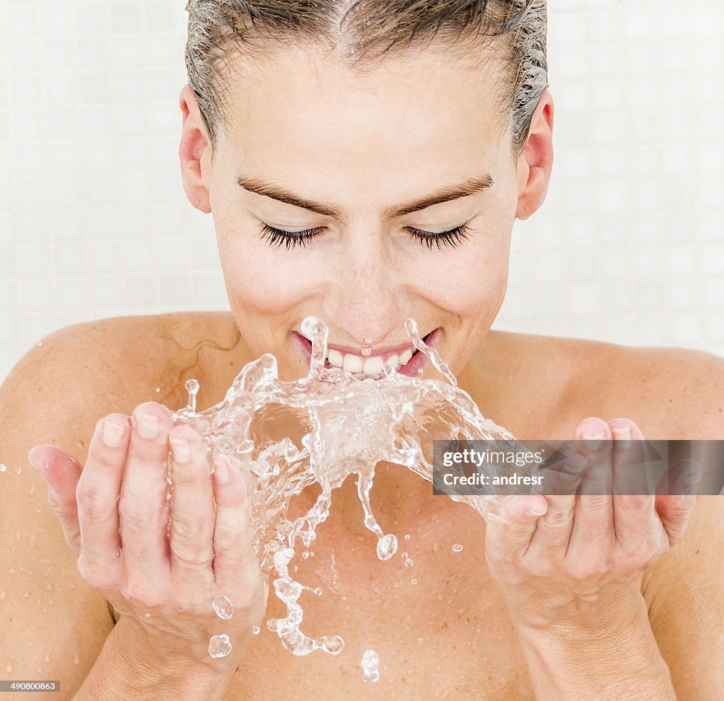 Woman washing her face