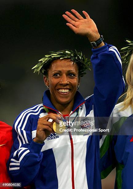 Gold medalist Kelly Holmes of Great Britain celebrates on the podium during the medal ceremony of the women's 800 metre event on August 23, 2004...