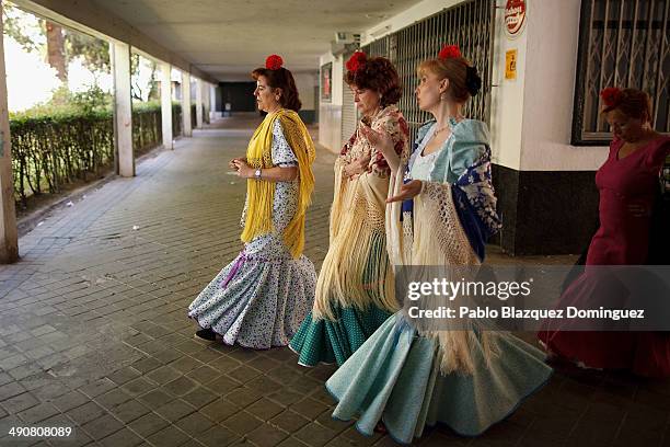 Chulapas' from the 'Association of Rompe y Rasga' make their way to Pradera de San Isidro park during the San Isidro festivities on May 15, 2014 in...