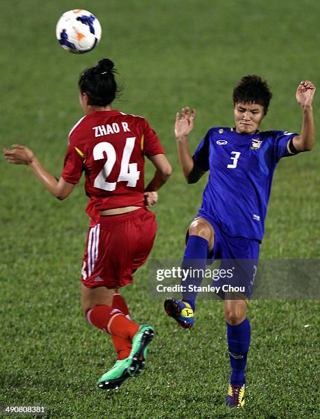 Zhao Rong of China battles with Natthakarn Chinwong of Thailand during the AFC Women's Asian Cup Group B match between China and Thailand at Thong...