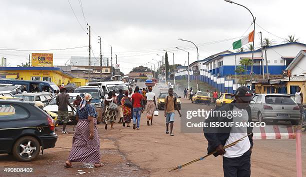 People walk on a street of Gagnoa, centralwestern Ivory Coast on September 29, 2015. Gagnoa is the home town of former president Laurent Gbagbo. AFP...