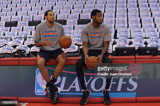 Grant Jerrett and Perry Jones of the Oklahoma City Thunder talk before Game Four of the Western Conference Semifinals against the Los Angeles...