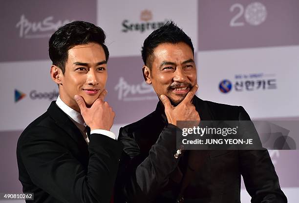 Hong Kong actor Simon Yam , also known as Yam Tat-Wah, and actor Han Ji-Seok pose on the red carpet for the opening ceremony of the Busan...