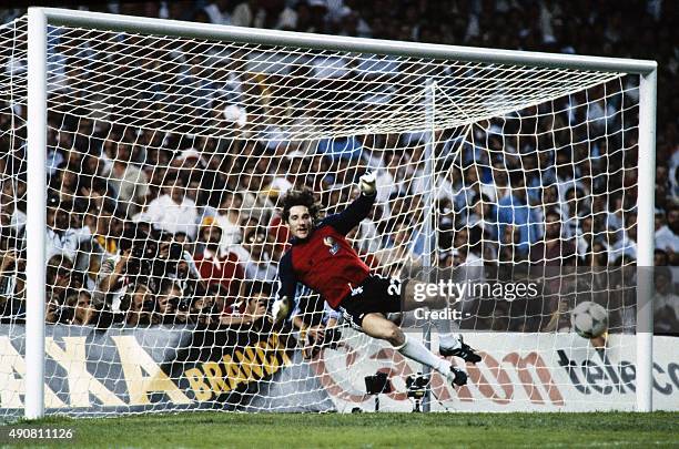 French goalkeeper Jean-Luc Ettori jumps for the ball during the 1982 World Cup semifinal football match between West Germany and France on July 8,...