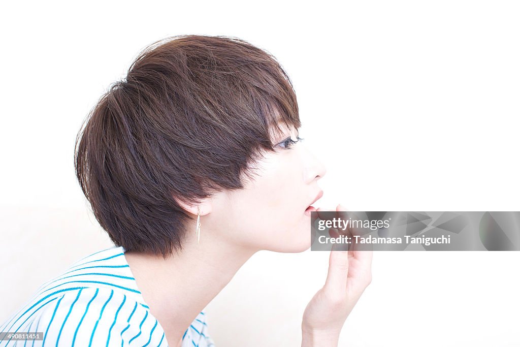 Woman touching her lip