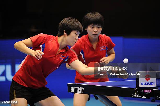 Kim Hye Song and Ri Mi Gyong of DPR Korea compete against Fukuhara Ai and Wakamiya Misako of Japan during Women's doubles quarter-final match of the...