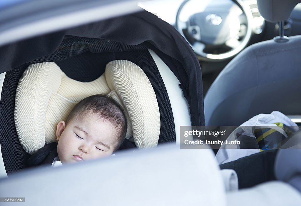 Baby sleeping in child car seat