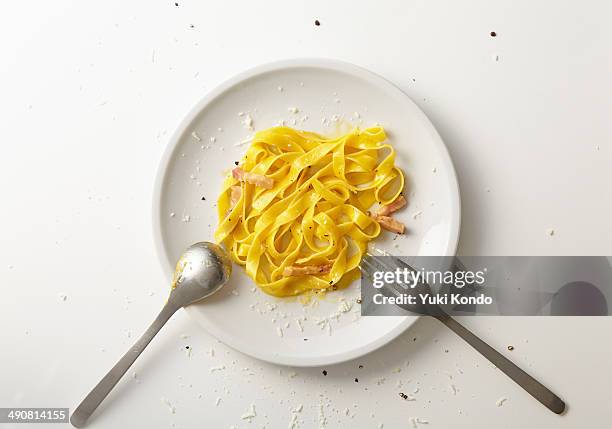spaghetti carbonara half-eaten. - eaten stock pictures, royalty-free photos & images