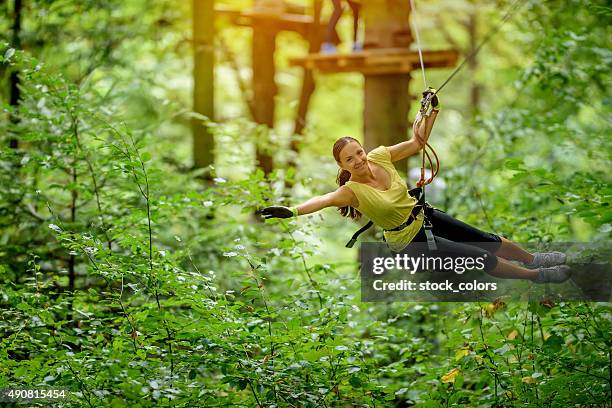 flying over forest with zip line - ziplining stock pictures, royalty-free photos & images